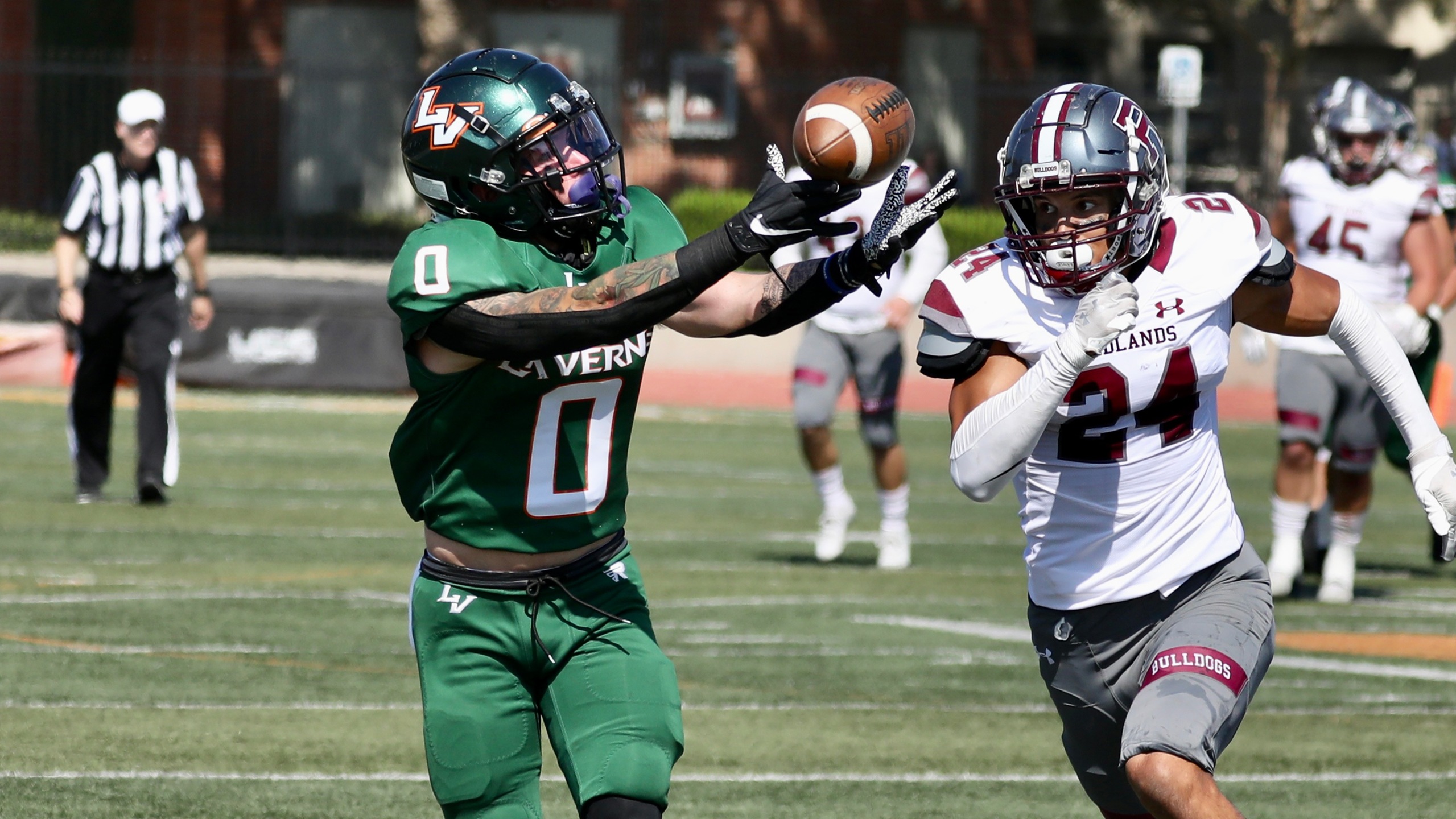 Spencer Pool hauls in a catch against Redlands.