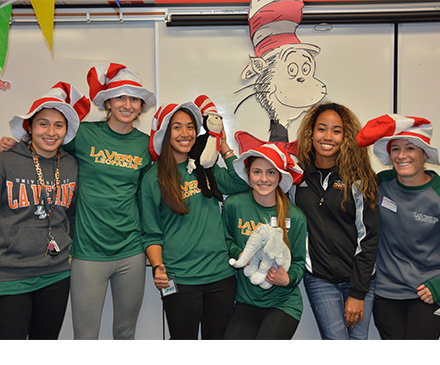 Women's Soccer Reads Dr. Seuss to Students